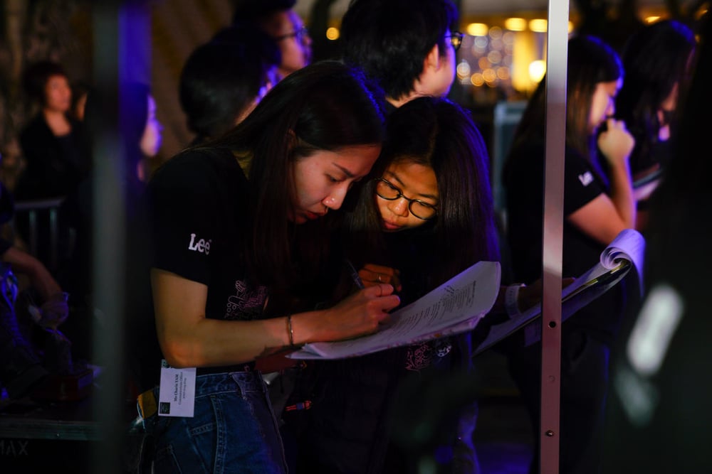 Earth Hour 2019 participants in Hong Kong reading a brochure