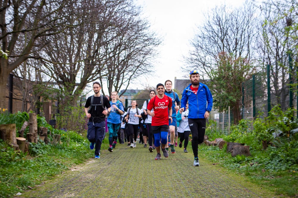 GoodGym runners arriving at Spitalfields City Farm to volunteer for Earth Hour 2019, London.